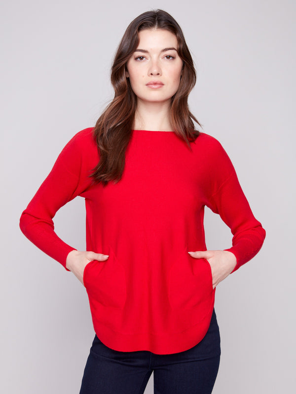 Versatile crimson sweater includes convenient front pockets, blending functionality with fashion by Charlie B.