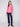 Elegant knit sweater in heather rose with convenient front pockets and ribbed texture by Charlie B.