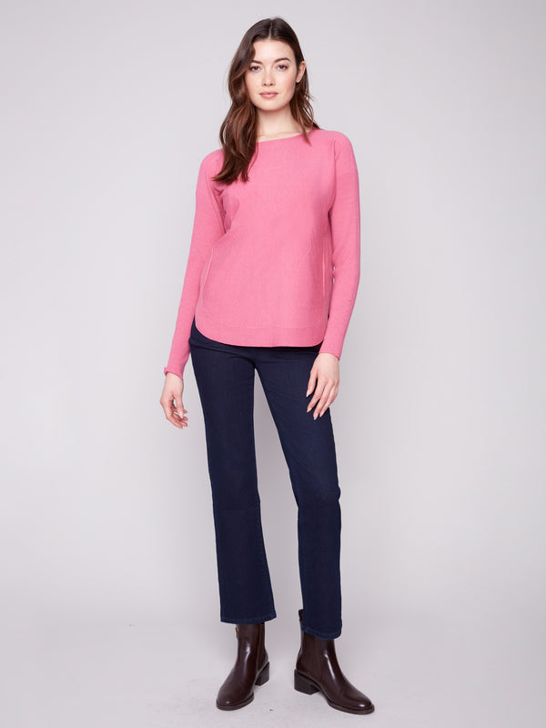 Elegant knit sweater in heather rose with convenient front pockets and ribbed texture by Charlie B.