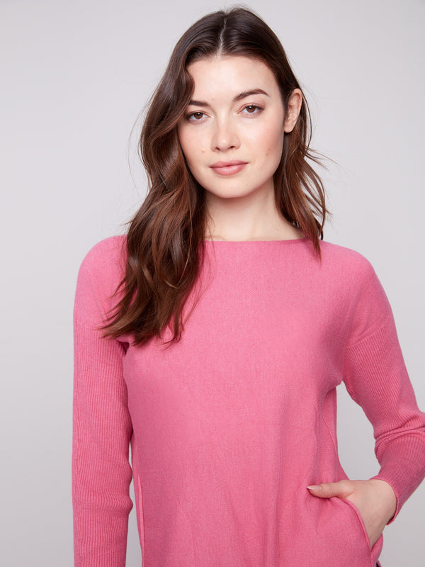 Stylish heather rose sweater designed with a rounded hem, perfect for a modern look by Charlie B.