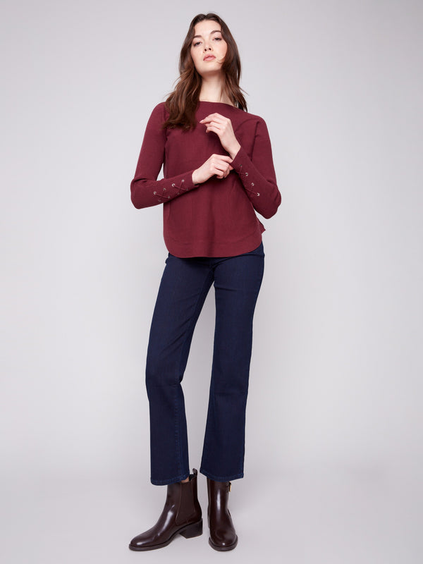 Elegant cabernet sweater with long ribbed sleeves offering a cozy and chic look by Charlie B.