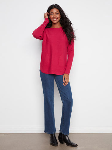 Enhance your wardrobe with this knit sweater, boasting long ribbed sleeves and convenient side pockets by Charlie B.