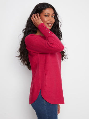 A chic truffle sweater with a rounded hem and lace-up cuff details, offering both style and comfort by Charlie B.