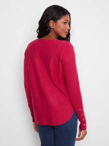 This elegant sweater features a flattering boat neckline paired with ribbed sleeves for added texture by Charlie B.