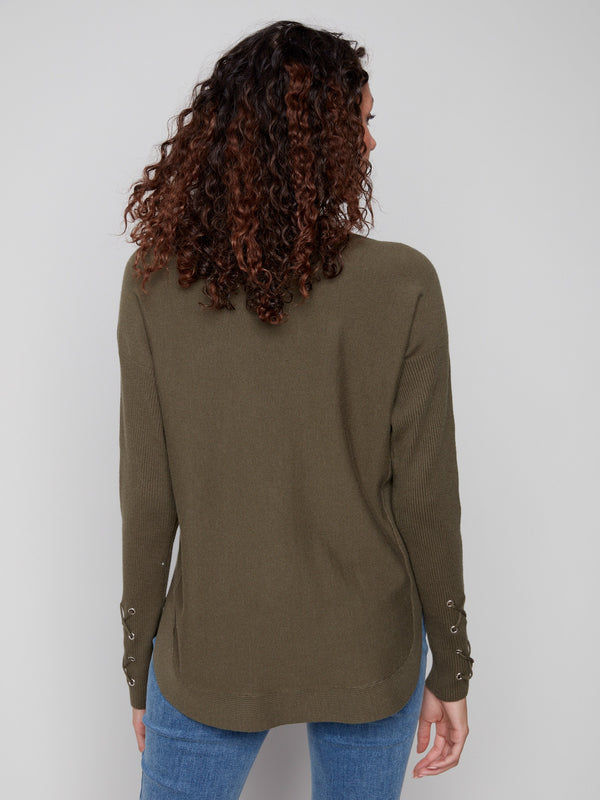 Chic spruce sweater showcasing unique cuff lace-up details, perfect for any casual outing by Charlie B.