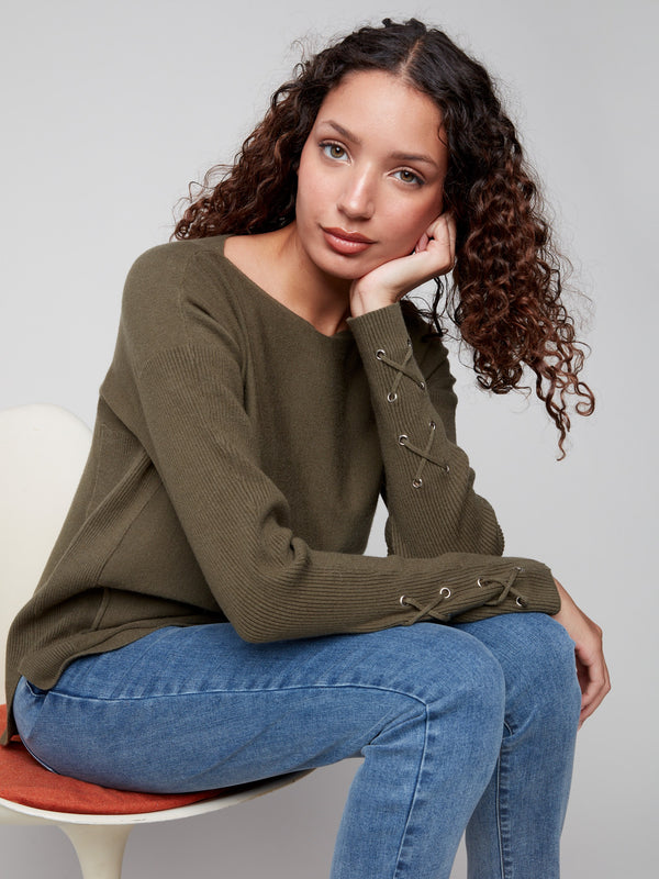 Comfortable knit sweater with side pockets, ideal for keeping essentials close at hand by Charlie B.