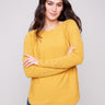 Honey knit sweater featuring a stylish boat neck design and ribbed texture by Charlie B.
