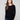 Black knit sweater featuring a boat neck design, complemented by long ribbed sleeves for a sleek look by Charlie B.