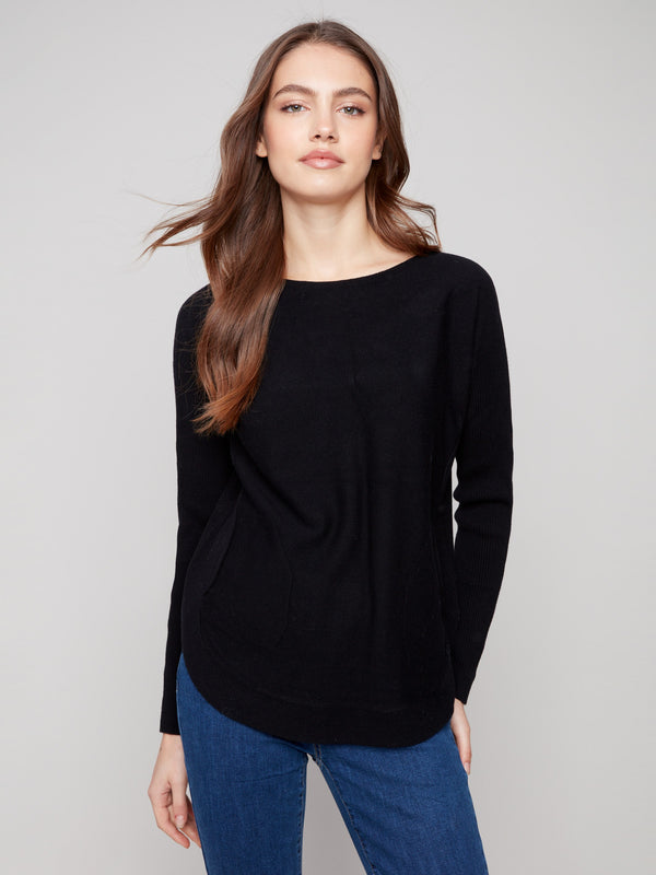 Black knit sweater featuring a boat neck design, complemented by long ribbed sleeves for a sleek look by Charlie B.