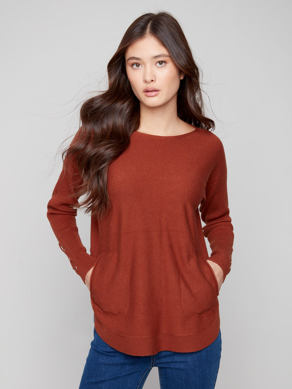 Sepia knit sweater featuring a stylish boat neck and practical side pockets, perfect for casual outings by Charlie B.