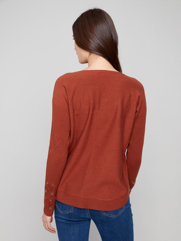Elegant sepia knit sweater showcasing unique cuff lace-up details for a touch of sophistication by Charlie B.