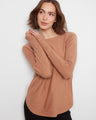 Sweater featuring a classic boat neck, adding elegance and style to any outfit. Perfect for casual or dressy occasions. By Charlie B.