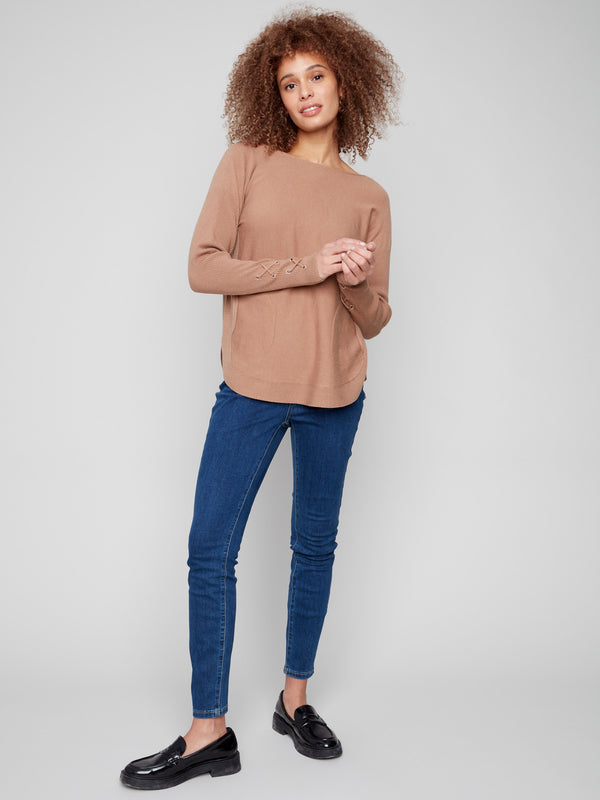 Elegant knit sweater with long ribbed sleeves and trendy lace-up cuffs for added flair by Charlie B.