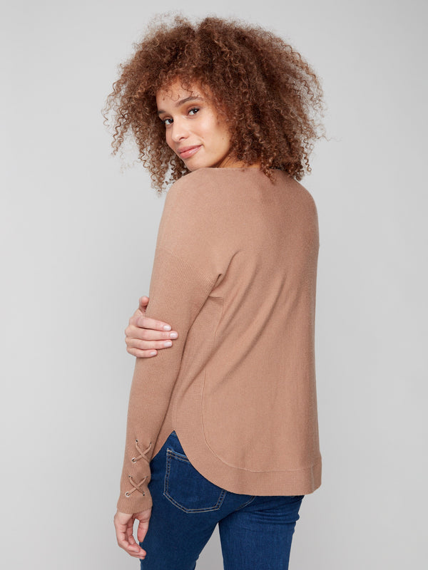 Stylish truffle knit sweater showcasing a rounded hem for a flattering silhouette by Charlie B.