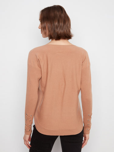 Convenient side pockets blend functionality with fashion in this stylish sweater, perfect for keeping essentials close by. By Charlie B.