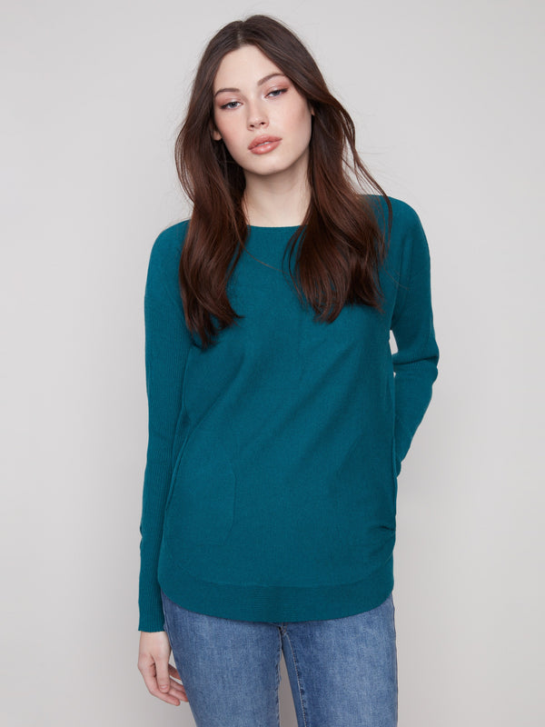 Evergreen knit sweater featuring a stylish boat neck and long ribbed sleeves, perfect for any casual occasion by Charlie B.