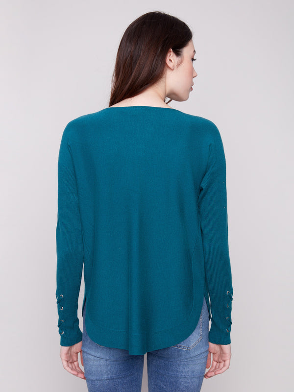 Chic knit sweater in evergreen with a flattering rounded hem and ribbed sleeves for added comfort by Charlie B.