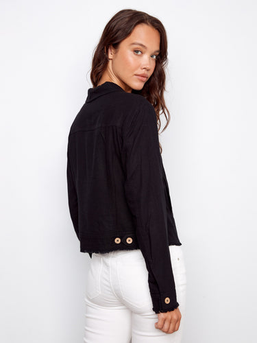 The classic short length of the jacket provides an elegant silhouette suitable for various occasions and styles. By Charlie B.