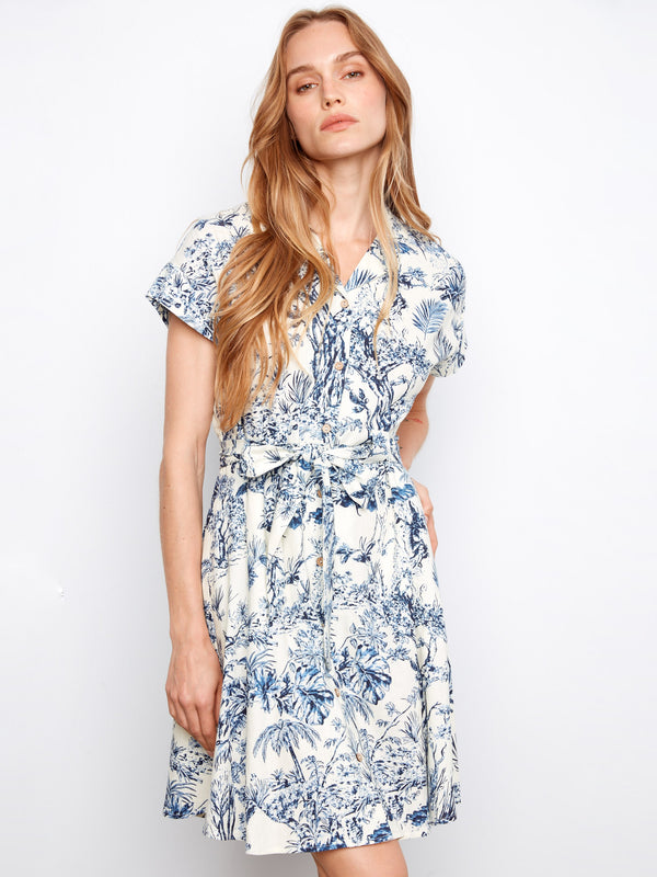 Chic short-sleeve dress with hidden pockets and a self-tie waist, adorned in blue floral patterns by Charlie B.