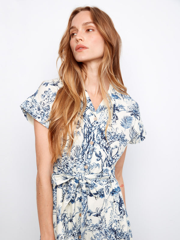 Short sleeve dress with self-tie at the waist and intricate blue floral design, offering style and comfort by Charlie B.