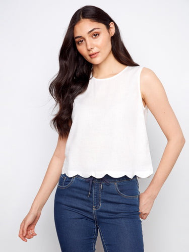 Enjoy the freedom of movement with its sleeveless design, perfect for layering or wearing on its own in warmer weather by Charlie B.