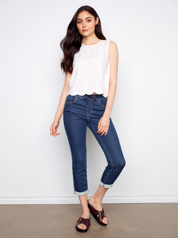 A must-have in any wardrobe, this sleeveless design is enhanced with delicate scallop edges for a unique look by Charlie B.