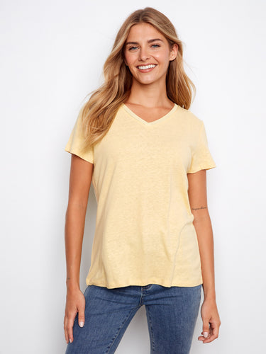 Soft yellow V-neck shirt offering a relaxed silhouette, great for warm days and casual styling. A versatile piece by Charlie B.
