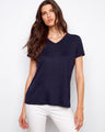 Navy V-neck T-shirt in a relaxed fit, paired effortlessly with white pants for a casual look by Charlie B.