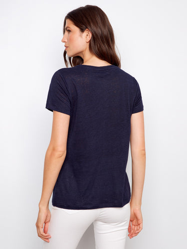 Casual navy T-shirt in a relaxed fit, made from linen blend and styled with white pants for comfort by Charlie B.