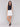 White linen blend skort with short length, styled with a black sleeveless top, by Charlie B.
