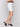 Wrap design white skort matched with a black sleeveless top, by Charlie B.