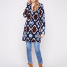 Crochet coat in twilight with a tailored collar, featuring geometric patterns and elegant design by Charlie B.