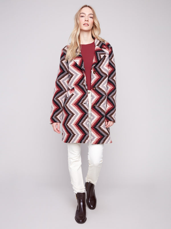 Primrose crochet coat with button closure and striking geometric pattern, perfect for any occasion by Charlie B.