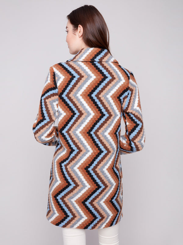 Unlined crochet coat in sepia with a striking geometric pattern, perfect for layering in style by Charlie B.
