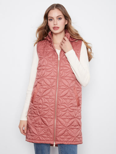 This rosebud vest features a zip-front closure, offering both style and practicality for everyday wear by Charlie B.