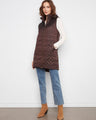 Quilted design vest with a sleek zip-front closure, perfect for layering in cooler weather. By Charlie B.