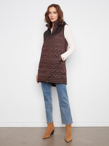 Quilted design vest with a sleek zip-front closure, perfect for layering in cooler weather. By Charlie B.