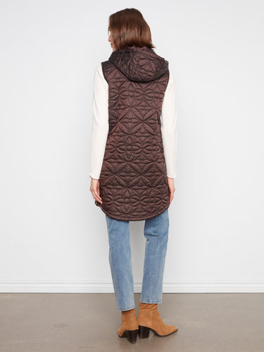 Equipped with practical welt pockets, this vest combines functionality with fashion effortlessly. By Charlie B.