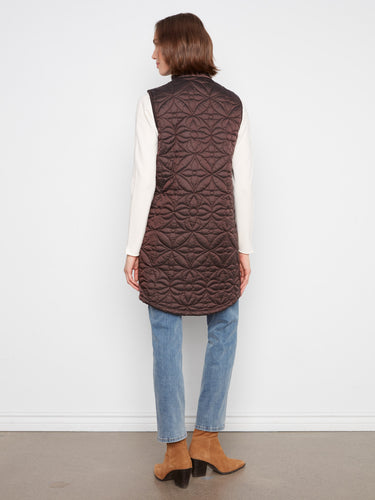 Side snap buttons add a touch of versatility to this stylish quilted vest, ideal for adjustable comfort. By Charlie B.