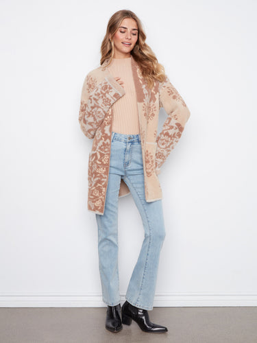 Experience the chic drop shoulder design of this cardigan, offering both style and comfort in one versatile piece by Charlie B.
