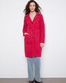 Red coat featuring a button closure and tailored neckline, perfect for a chic look. By Charlie B.