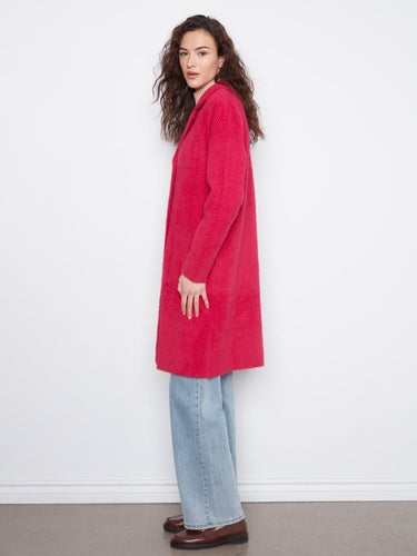 Elegant red coat with a tailored neckline, ideal for both casual and formal settings. By Charlie B.