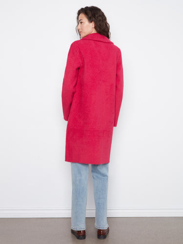 Longline silhouette of the red coat offers a flattering fit, combining style with comfort. By Charlie B.