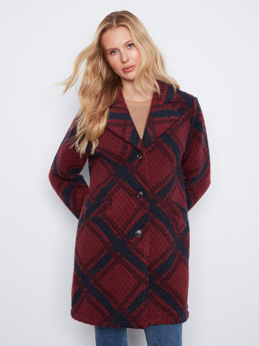Stylish plaid coat featuring welt pockets, perfect for keeping essentials handy. By Charlie B.