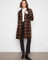 The coat features a notched collar that adds a classic touch to its design, perfect for elevating any outfit. By Charlie B.