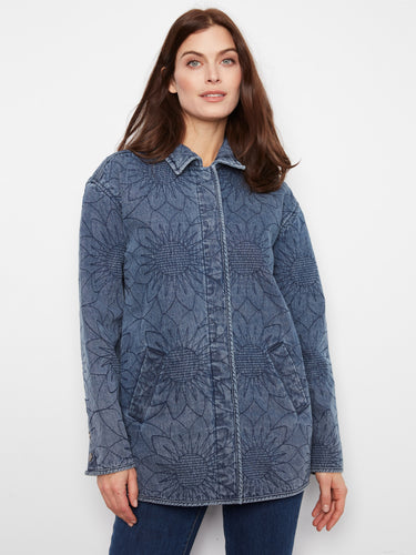Blue quilted denim jacket with a floral design, featuring a snap button closure and welt pockets. Stylish and functional by Charlie B.