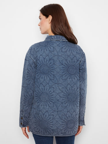 Chic quilted denim jacket in medium blue featuring floral designs, complete with shirt collar and relaxed fit elegance by Charlie B.