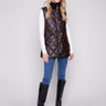 Mocha faux leather vest featuring a rib knit neck and stylish snap button front closure, perfect for layering by Charlie B.