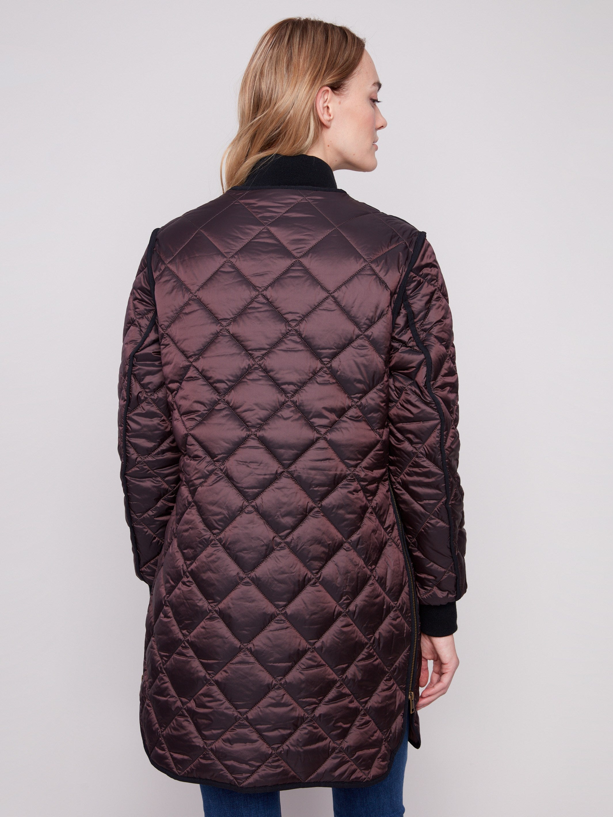 Elegant long quilted design in mocha with convenient two front welt pockets for practicality by Charlie B.