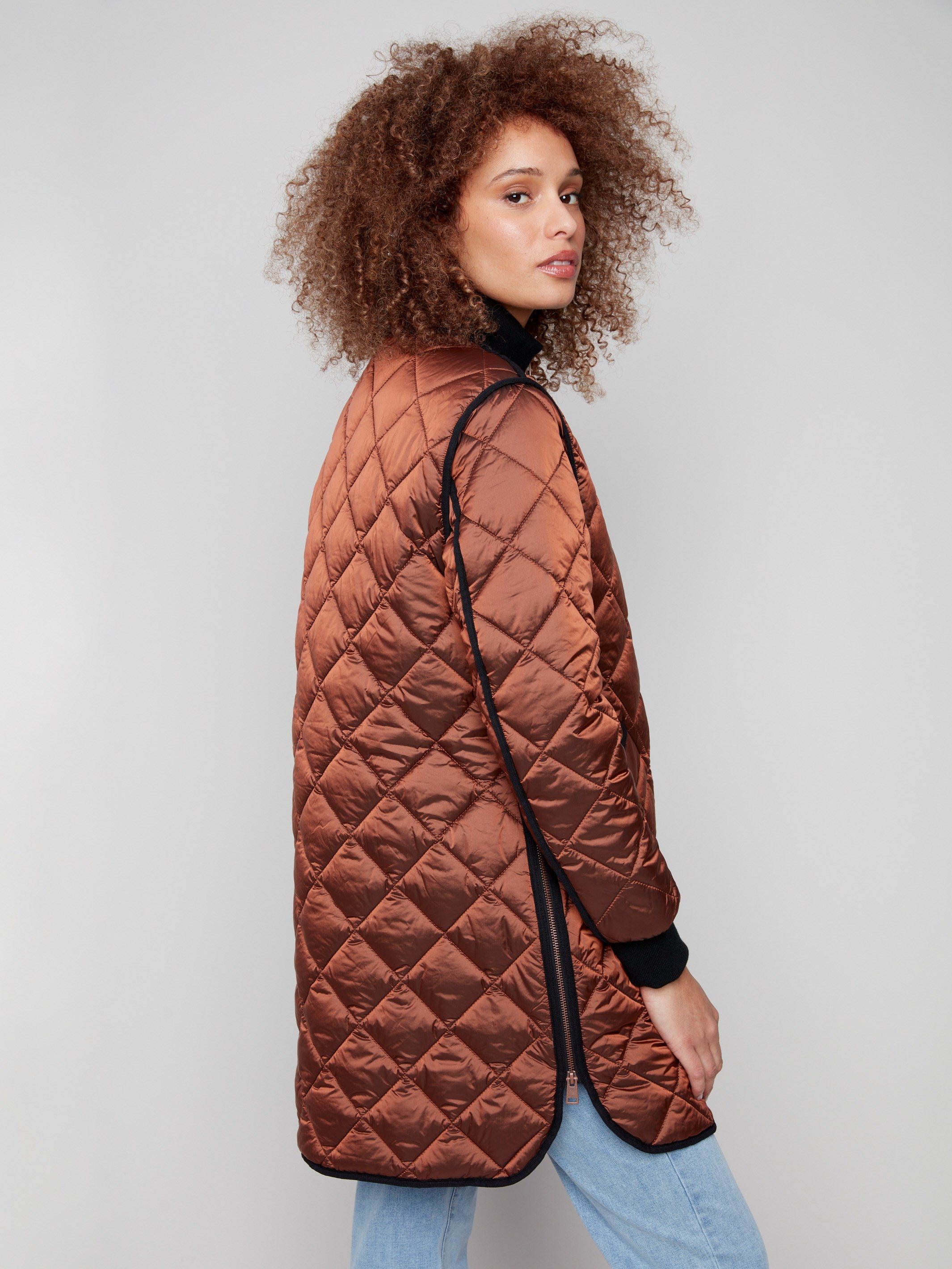 Sepia long quilted jacket with practical side zipper details for versatile wear by Charlie B.